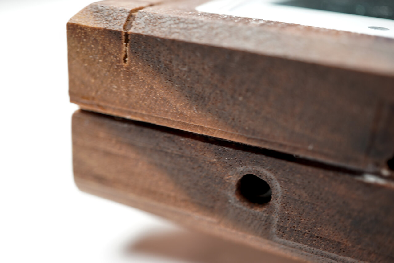 Detail photo of hole for the AC adapter plug.